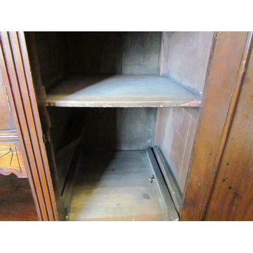 1107 - An Edwardian mahogany carved sideboard, three drawers above three cupboards with carved floral doors... 