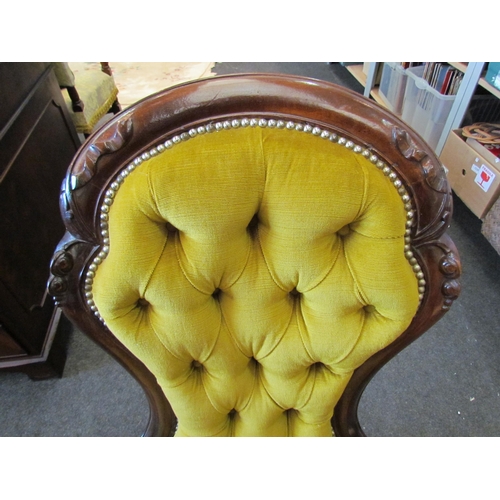 1113 - A late Victorian button back open armchair with gold upholstery stud detail