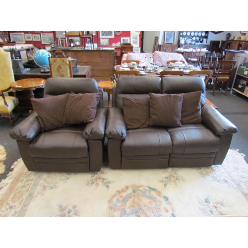 1118 - An Argos brown leather two seater electric reclining sofa and matching armchair with five cushions