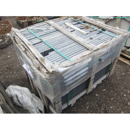 3614 - A pallet of black stone slabs