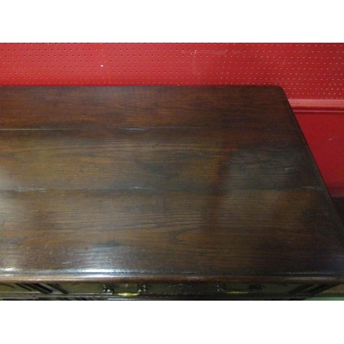 4028 - A 19th Century French pegged oak dresser base, the two drawers over a two door cupboard on stile fee... 