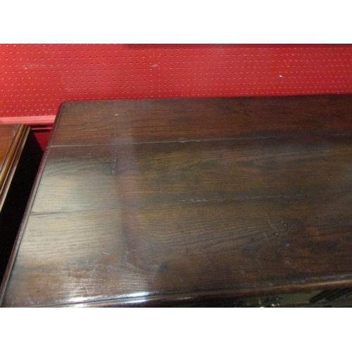 4028 - A 19th Century French pegged oak dresser base, the two drawers over a two door cupboard on stile fee... 