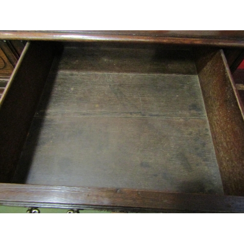 4028 - A 19th Century French pegged oak dresser base, the two drawers over a two door cupboard on stile fee... 