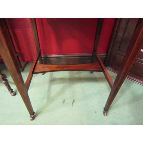 4052 - An Edwardian inlaid rosewood writing desk, the raised shelf back and two drawers over a hinged fall ... 