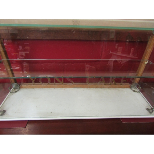 4055 - A Lyons Cake vintage glass display cabinet (missing doors), 38cm tall x 76cm long x 23cm deep