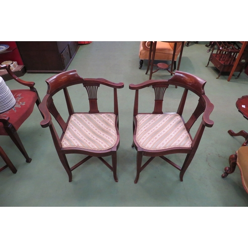 4059 - Three Edwardian mahogany corner chairs, urn marquetry panel, pierced splats, on shaped supports, one... 