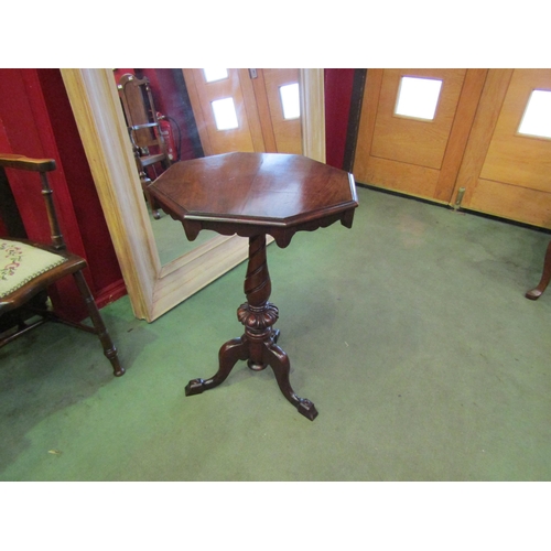 4065 - A late Victorian mahogany octagonal top wine/lamp table with shaped apron over a baluster turned spi... 