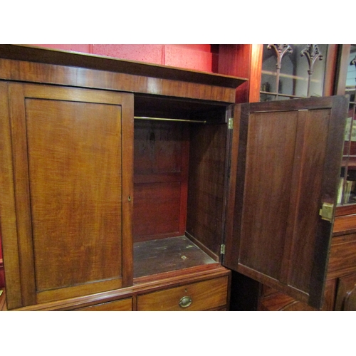 4121 - A Circa 1840 flame mahogany linen press with black line inlaid decoration, the two doors with key op... 