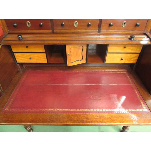 4127 - An early Victorian mahogany roll top desk, the three raised drawers over a tambour front (locking ke... 