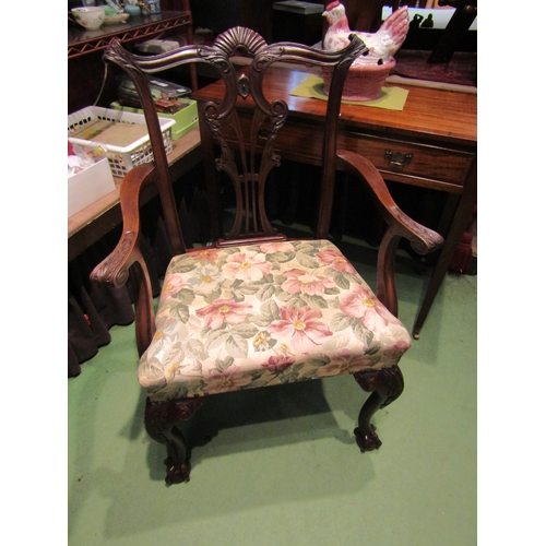 4153 - A Georgian carved mahogany armchair with acanthus leaf and fan carved pierced central splat having s... 