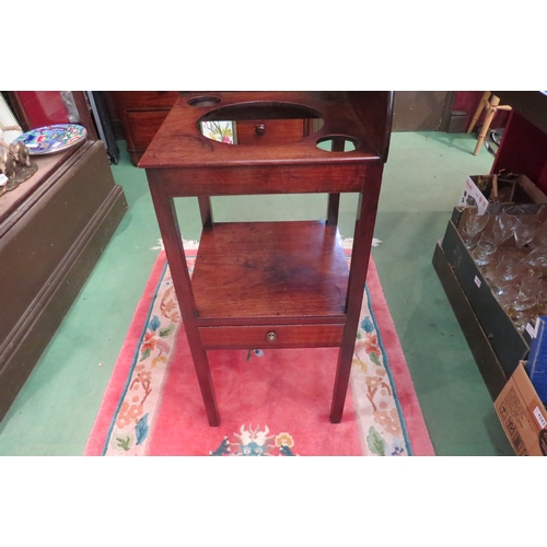 4173 - A George III mahogany two tier gentleman's corner washstand, the raised back over bowl recesses on s... 