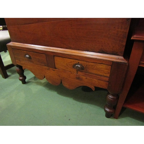 4188 - A late Victorian Anglo-Indian teak chest on base, the hinged lid over two drawers and turned legs jo... 