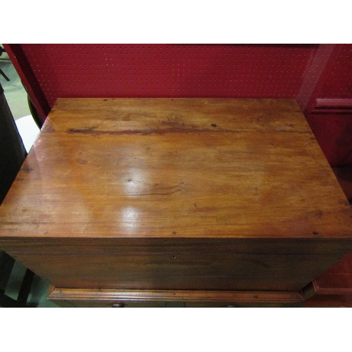 4188 - A late Victorian Anglo-Indian teak chest on base, the hinged lid over two drawers and turned legs jo... 