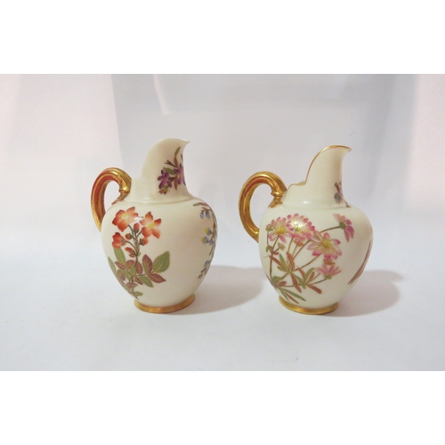 4300 - Two cushion back Royal Worcester vases, both decorated with sprigs of flowers, gilt embellishment, 1... 