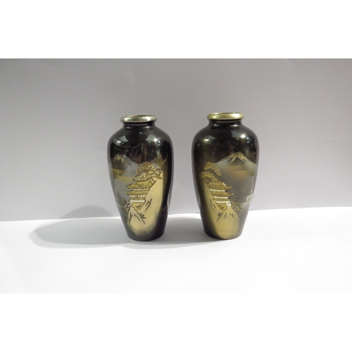 4383 - A pair of miniature Japanese vases depicting Mount Fuji, 11cm tall