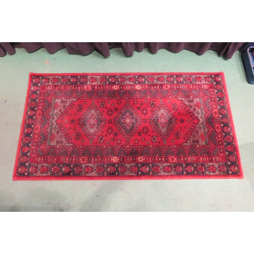 4003 - A Super Taj Belgian red ground wool rug with multiple borders, 156cm x 83cm  (R)  £40