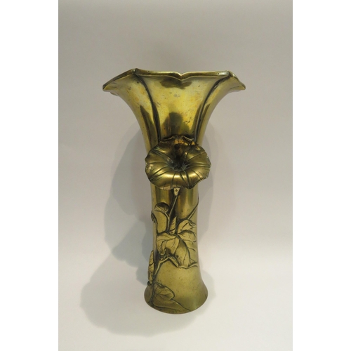 4010 - An early 20th Century Oriental brass vase with applied floral design, flared rim, character marks to... 