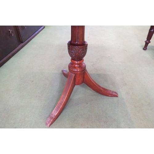 4016 - A reproduction walnut tripod wine table, rectangular tray top with wavy edge, over a carved column t... 