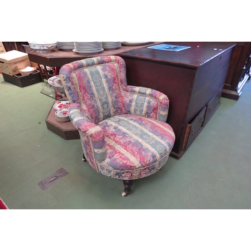 4018 - A circa 1900 armchair on ring turned tapering fore legs on white ceramic castors