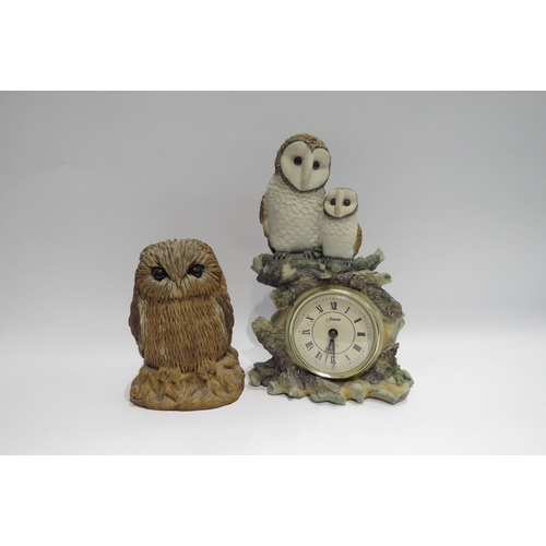 4030 - A resin figure of an Owl by Diane Skinner, 16cm tall, and a resin figural timepiece (quartz) surmoun... 