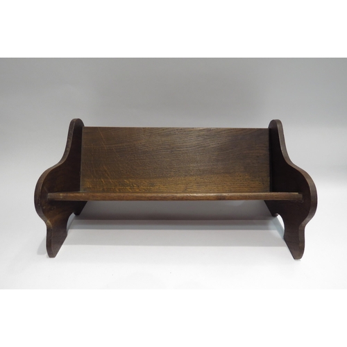 4031 - An oak bookrest, carved thistle side panels, a/f, 17.5cm tall x 41cm long