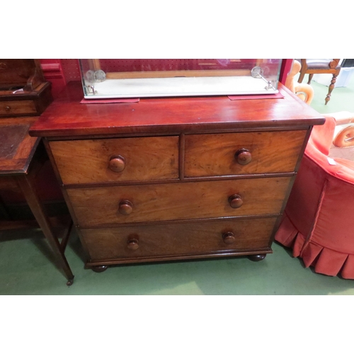 4056 - A Circa 1840 flame mahogany chest of two short over two long drawers with turned bun handles and hal... 