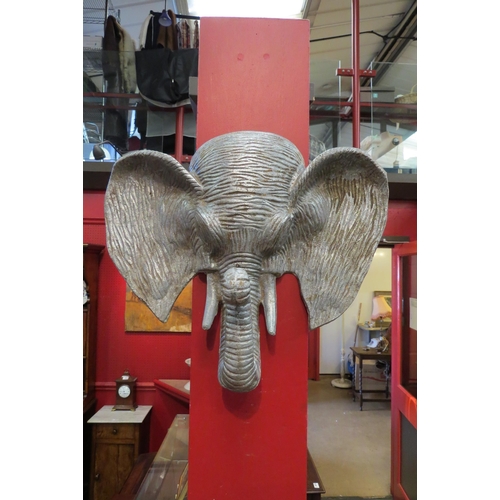 4057 - An aluminium and zinc elephants head wall plaque, 33cm tall x 41cm wide