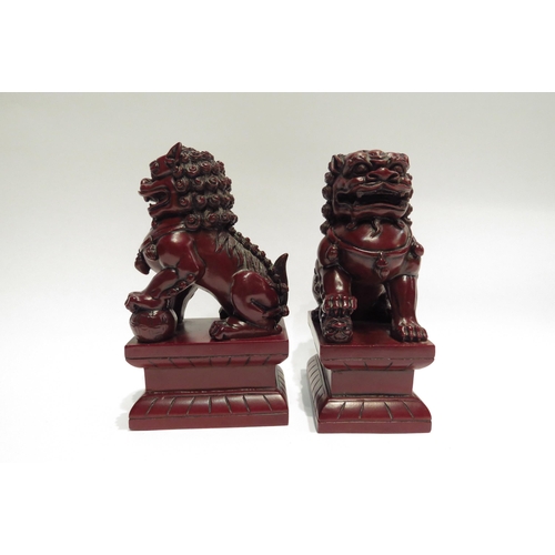 4066 - A pair of temple dog book-ends, 17cm tall