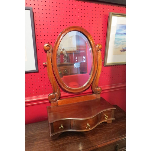 4077 - A hardwood dressing chest mirror with three drawer serpentine front