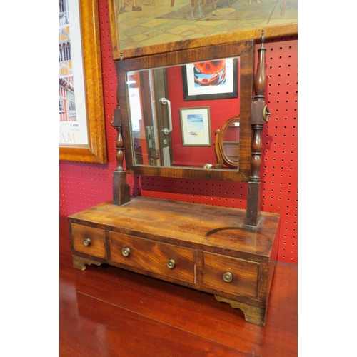 4083 - A 19th Century mahogany toilet mirror, turned supports with brass finials, three drawer base to brac... 