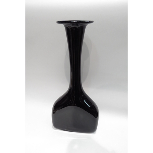 4093 - A large black glass vase with slender neck to flared rim, 45cm tall   (R)  £15