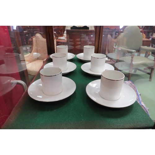 4095 - Nineteen Thomas of Germany coffee cans and saucers, white ground with silver coloured rims  (E)  £10... 