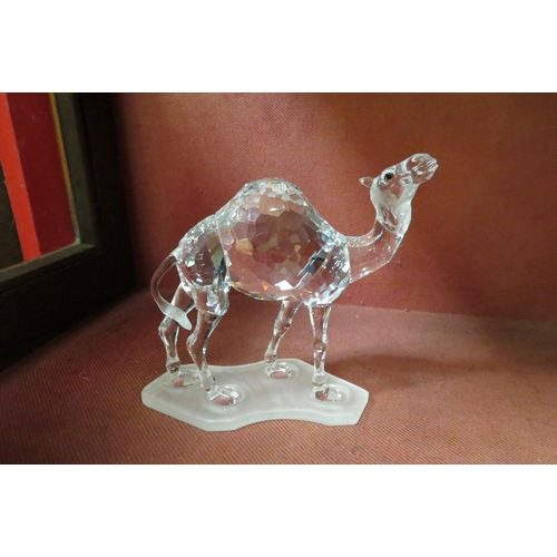 4111 - Four Swarovski crystal animal figures, Lion, Giraffe, Camel and Leopard (a/f), all boxed