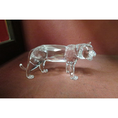 4111 - Four Swarovski crystal animal figures, Lion, Giraffe, Camel and Leopard (a/f), all boxed