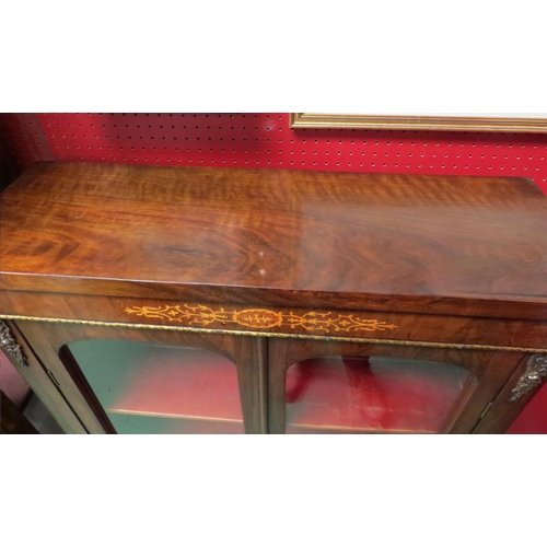 4116 - A Victorian inlaid walnut pier cabinet/bookcase with brass ormolu mounts, the two arched doors with ... 