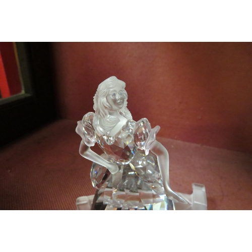 4117 - A Swarovski crystal figure of a young lady posing, boxed