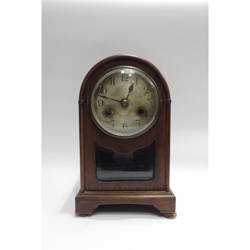 4130 - An oak cased arch top mantel clock marked Wurtemberg to dial, with key and pendulum