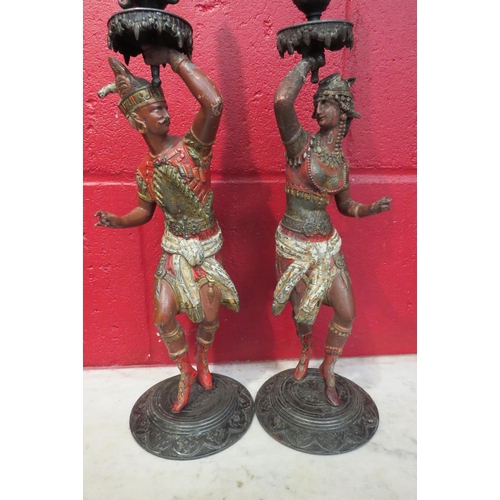 4142 - A pair of 19th Century painted candlesticks, figural form, 37cm tall  (R)  £100