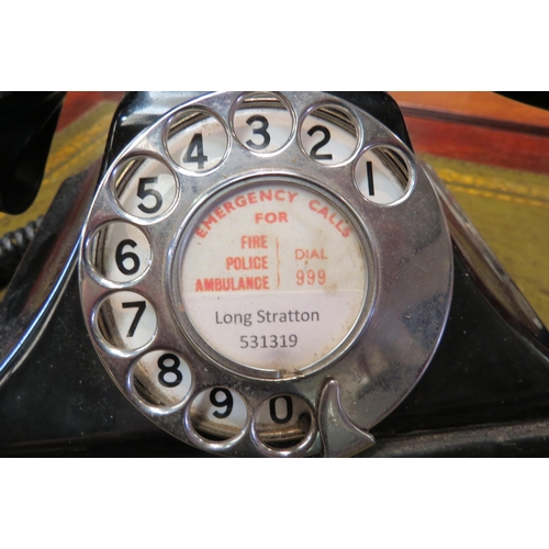 4165 - A vintage black bakelite telephone, Long Stratton paper dial centre handset a/f