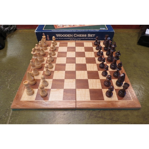 4166 - A boxed Gibsons chess set.  Inlaid wood board, wooden pieces.  Board - 36cm x 36cm.  King height - 7... 