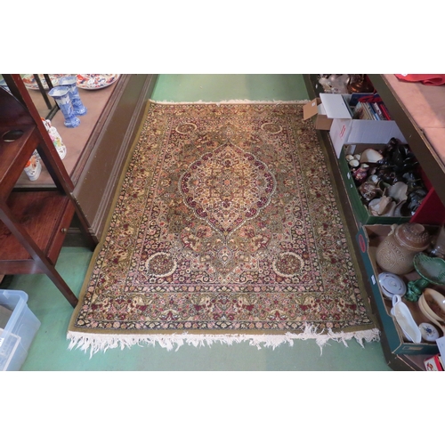 4174 - A Keshan wool rug, green ground, multiple borders, central medallion, 200cm x 140cm