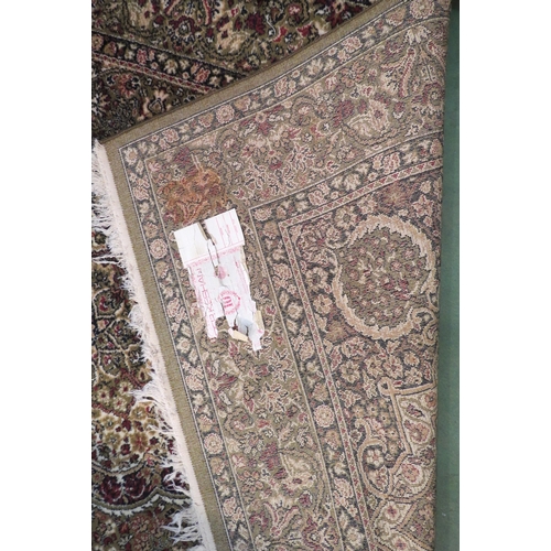 4174 - A Keshan wool rug, green ground, multiple borders, central medallion, 200cm x 140cm