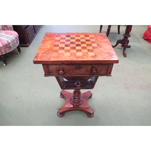 4191 - A Victorian walnut games table, the chequerboard top over a single deep drawer, on turned support to... 