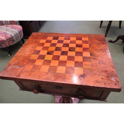 4191 - A Victorian walnut games table, the chequerboard top over a single deep drawer, on turned support to... 