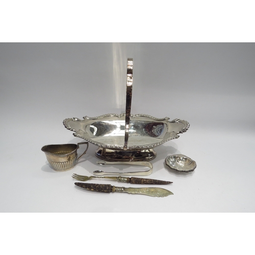 4390 - A small selection of plated ware to include basket, four shell bon-bon dishes and a pair of silver s... 