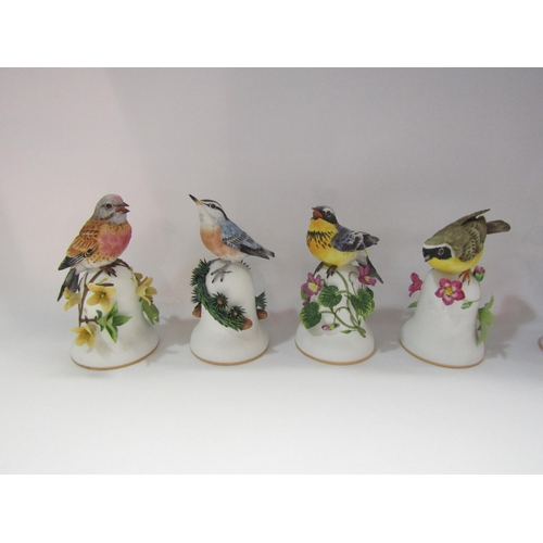 4237 - Four Franklin Mint ceramic bell's surmounted by birds and three similar glass examples