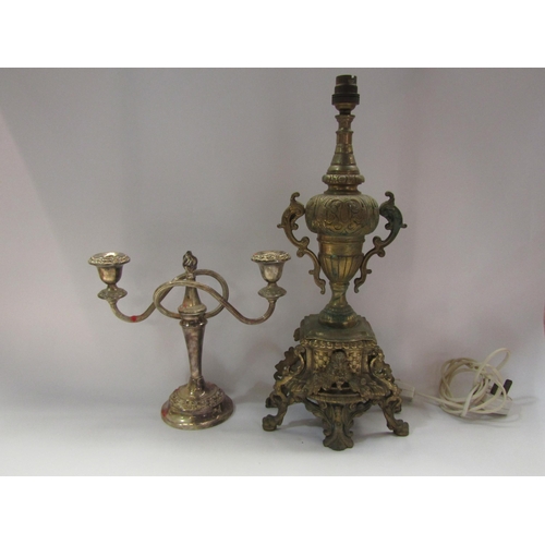 4259 - A heavy brass lamp base, a plated candelabra and a Player's 