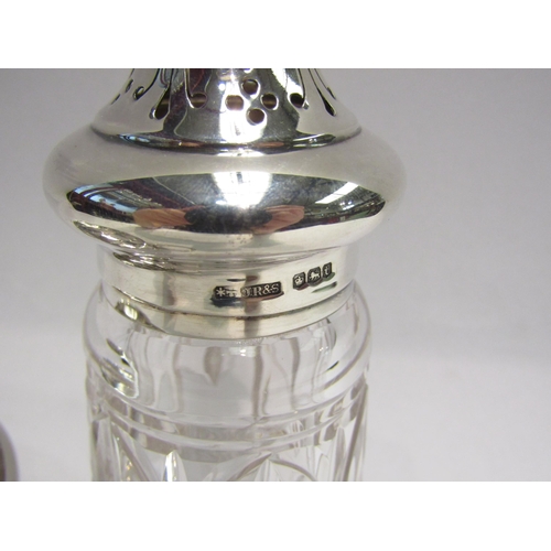 4289 - A silver sugar bowl, Birmingham, a sugar sifter with matched silver lid and a silver napkin ring (3)