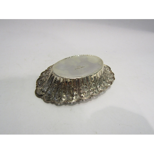 4314 - An oval silver bonbon dish with embossed and pierced decoration, hallmarked Sheffield 1895, James Di... 