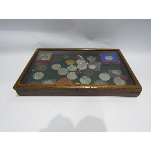 4333 - A display case containing a collection of Coronation and Death medals from George IV, Victoria to El... 